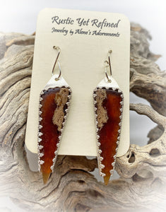 amber earring in natural setting