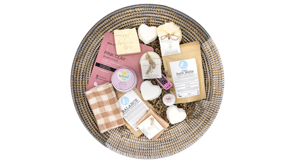 Pamper Hamper brimming with a collection of ethically sourced, cruelty-free, and zero waste beauty products presented in a hand woven African basket