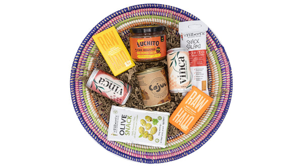 Gourmet Snackers Delight Hamper packed full of delectable treats sourced from responsible and sustainable producers presented in a handwoven African basket