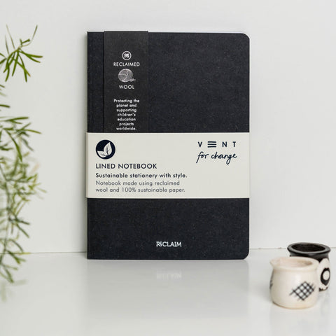 A5 notebook with covers made using reclaimed fabric with 100% certified sustainable inner paper pages