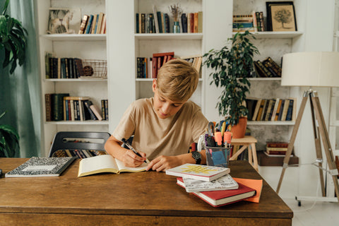 A child doing homework—a productive study space for your kids is essential