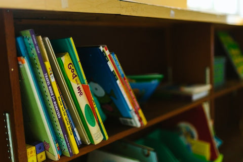 A shelf with children’s books.