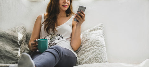 a woman scrolling through her phone