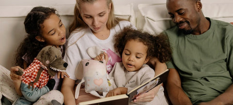 a happy family reading with kids