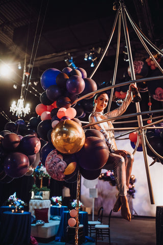 aerial bartender with hand painted balloons by revelry goods