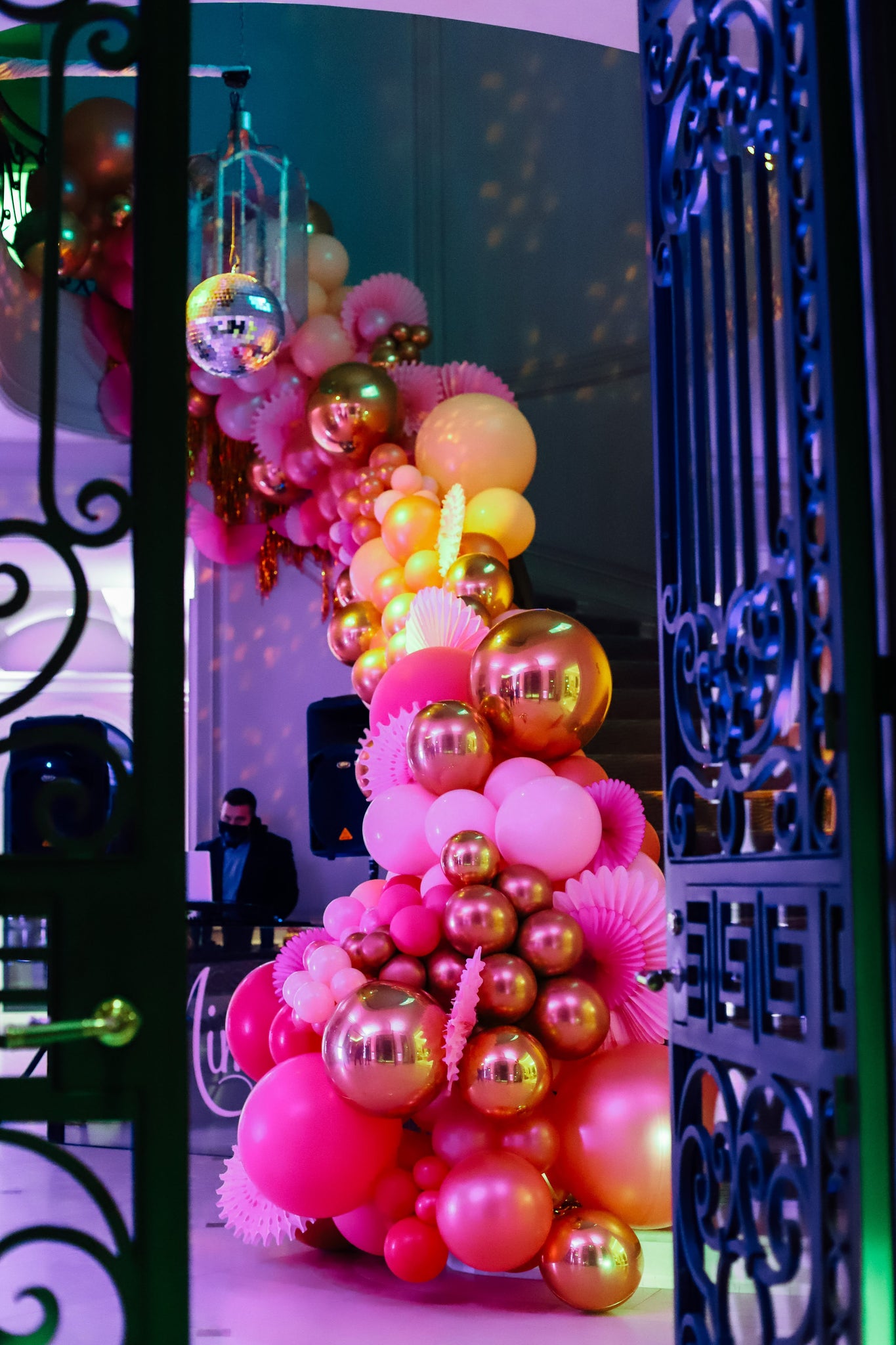 Pink and Gold balloon installation on stairs by Revelry Goods balloon artists