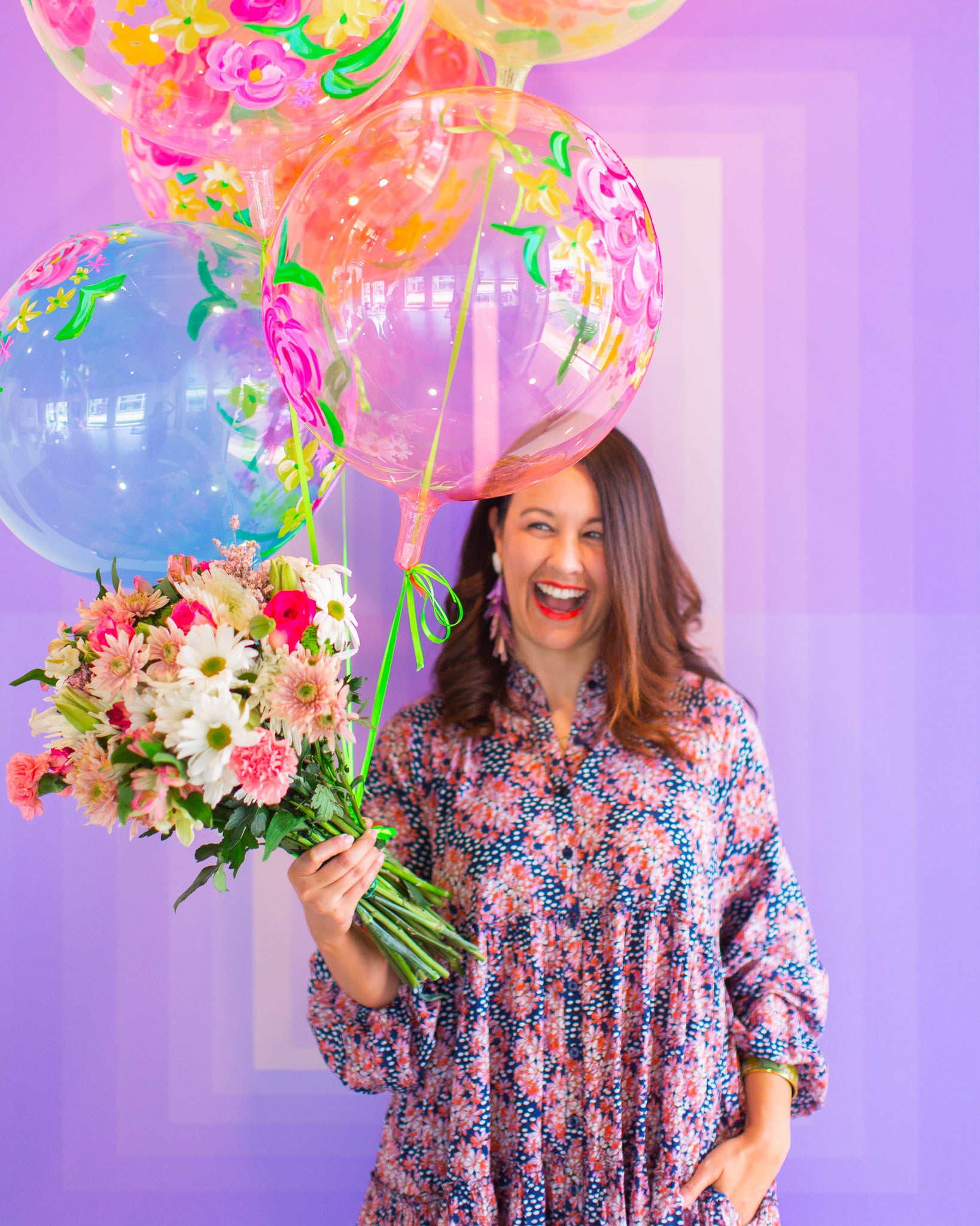 Carrie Colbert with hand painted floral balloons by Revelry Goods in Houston, TX