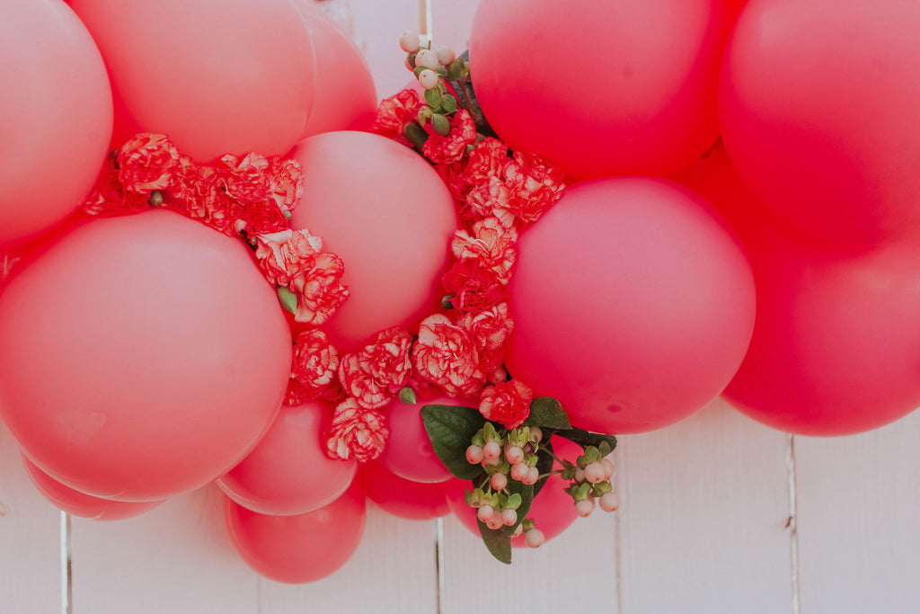 Pink balloons with flowers by Revelry Goods in Houston, TX 
