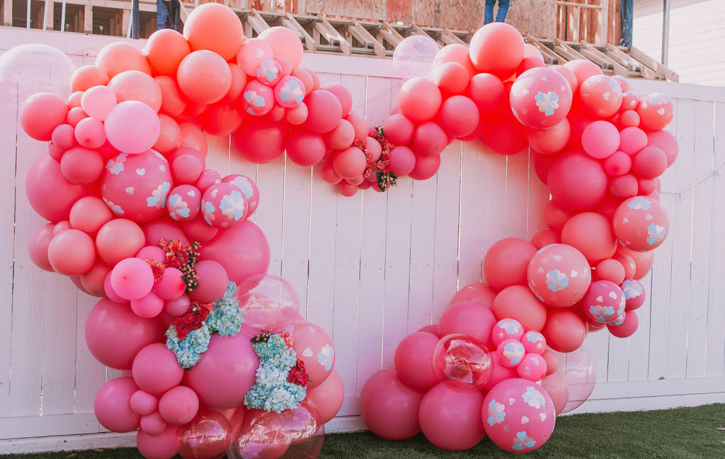 Revelry Goods hanpainted pink and blue Valentine's heart balloon installation in Houston, TX