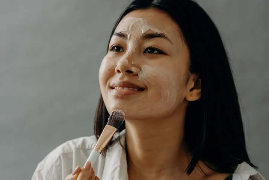 woman exfoliating her face