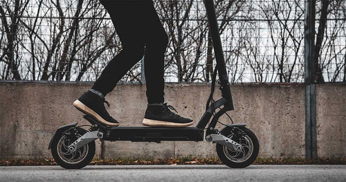 Close-up shot of electric scooter and the rider