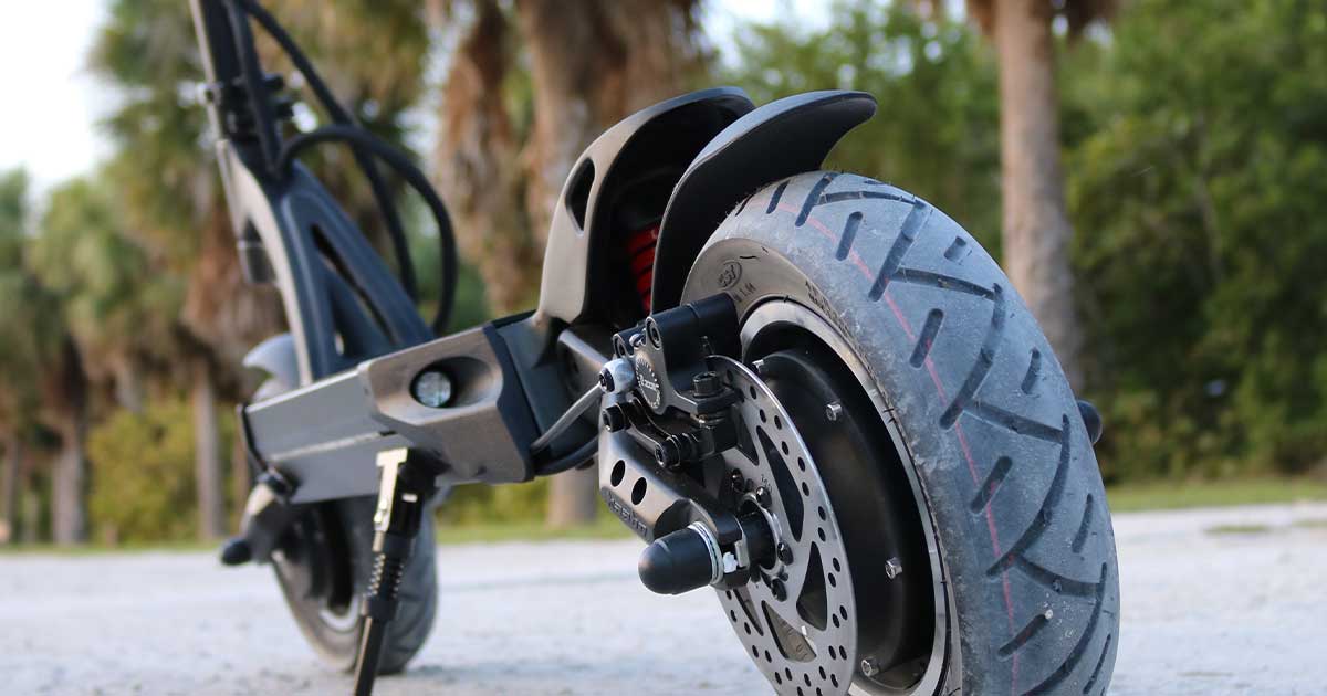 A close-up of an electric scooter’s wheel and braking system, emphasizing the technological advancements that are driving the electric scooter commuting revolution.