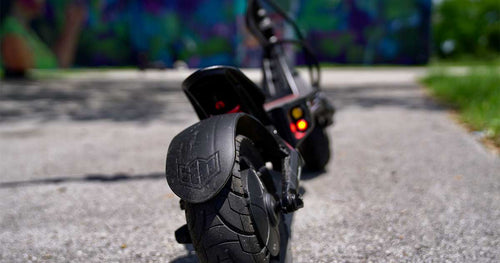 Close up image of an electric scooter wheel and body
