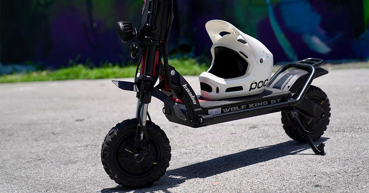 An advanced electric scooter named 'Wolf King GT' with chunky tires and a modern design, symbolizing the cutting-edge technology in electric scooter racing.