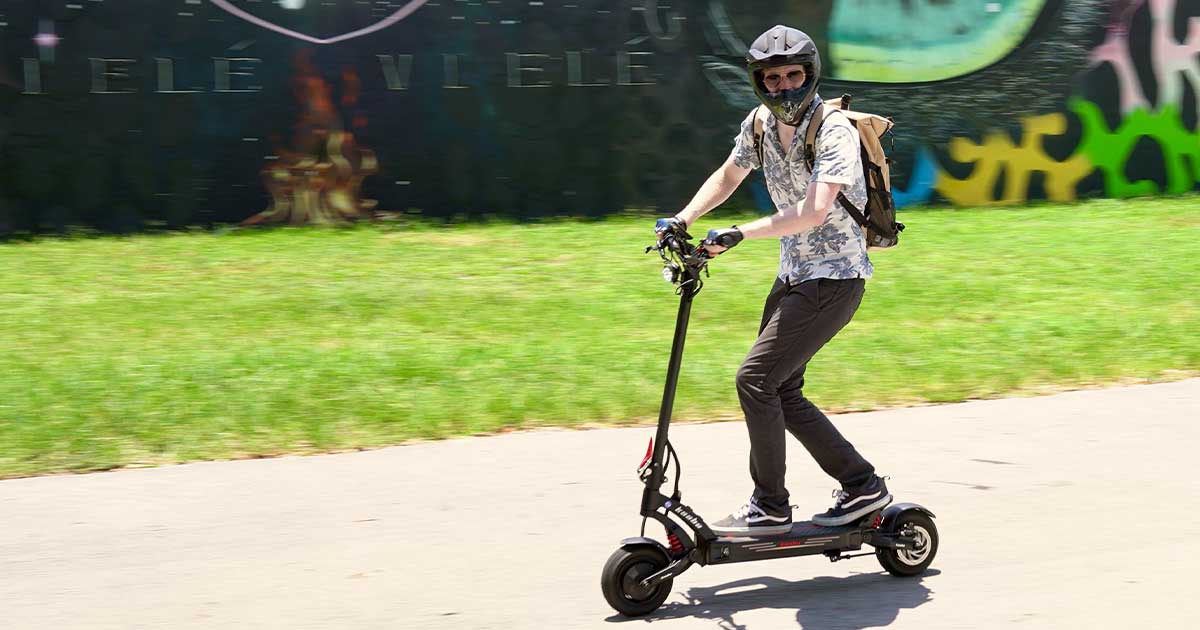 A trendy rider on a stylish electric scooter, blending the worlds of fashion and the emerging trend of electric scooter racing.