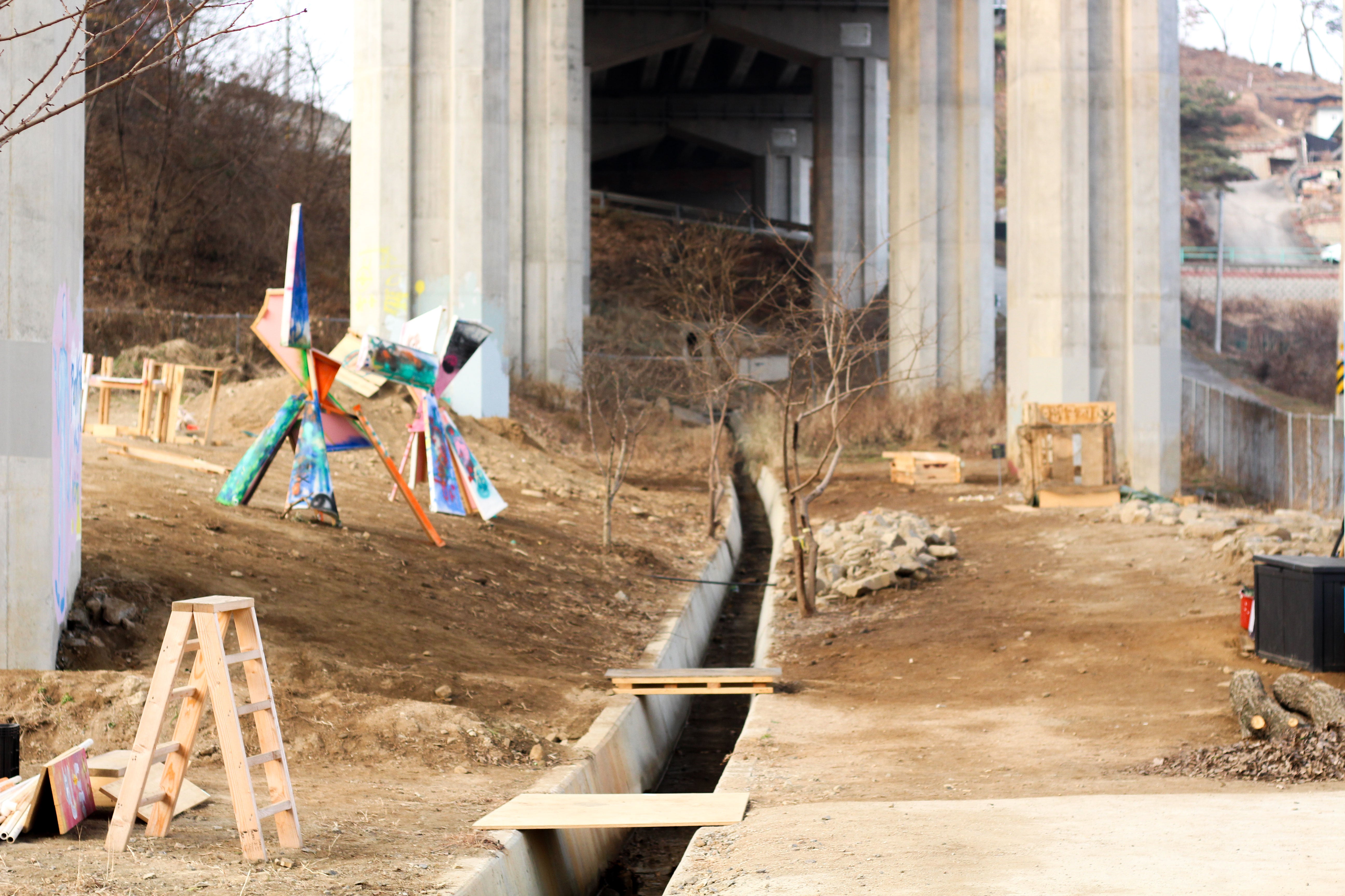 A stormwater drain running along the middle of the Bindoongplay playground.