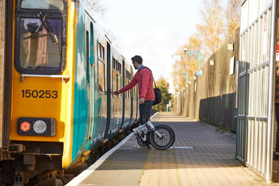ATTO folding bike boarding a train