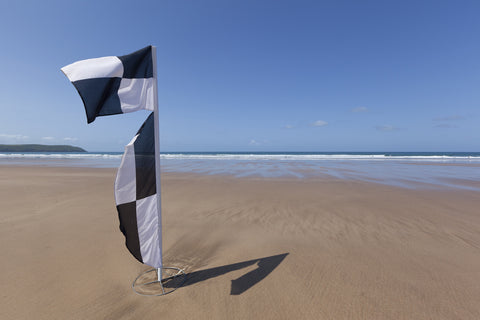 black and white beach warning flag