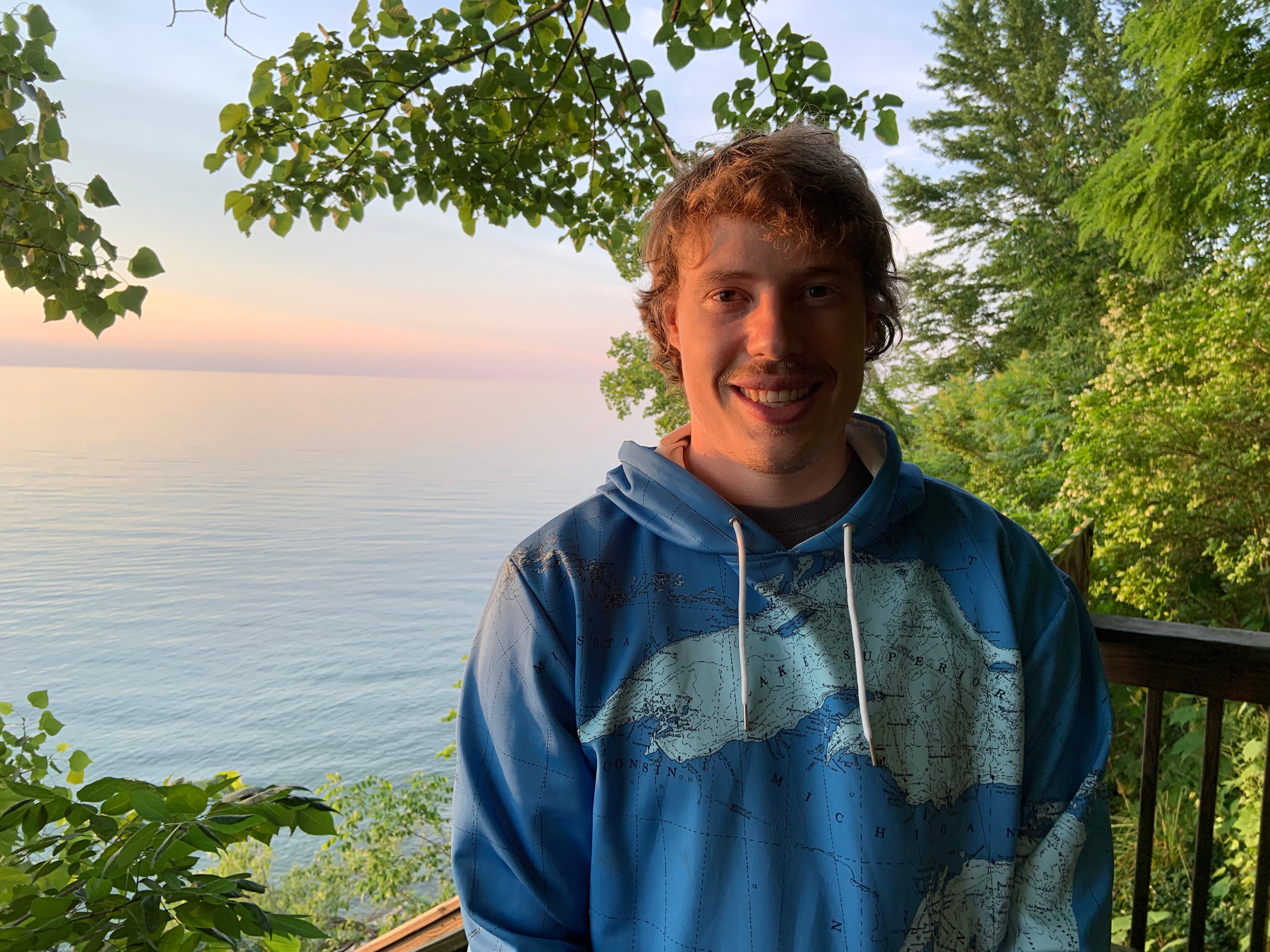 Wearing great lakes hoodie by the beach