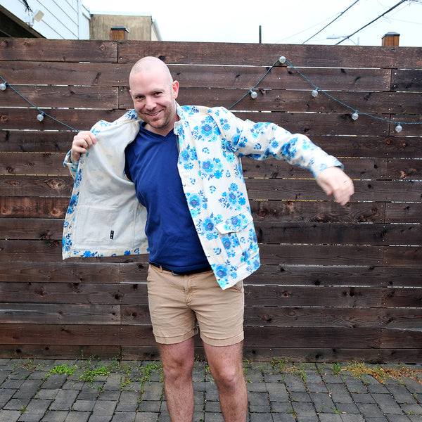 Tighe puts on the blue floral jacket