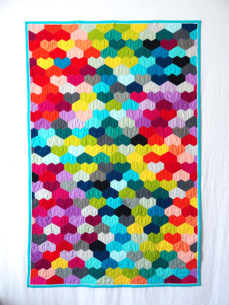 Heart quilt on white wall
