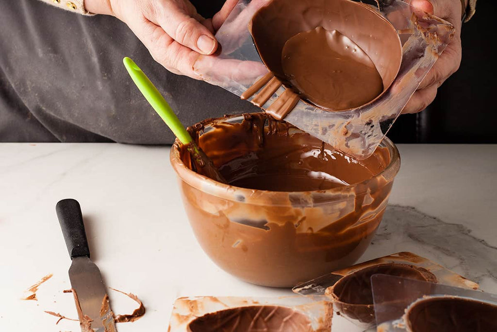 pour the chocolate out of the egg mold