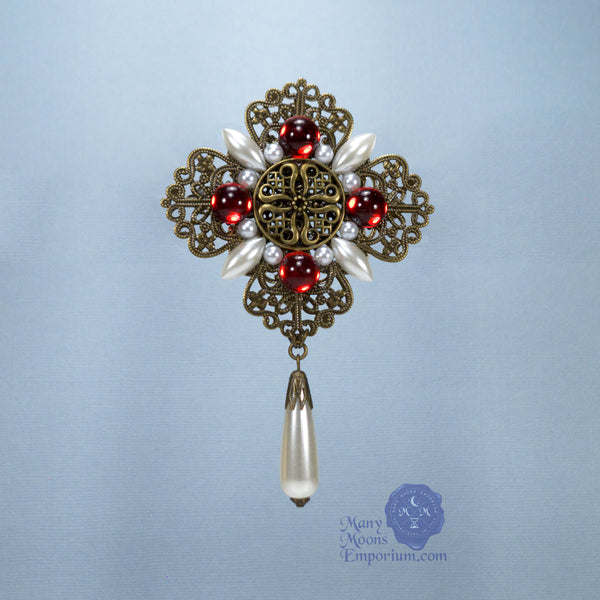 red brooch pin