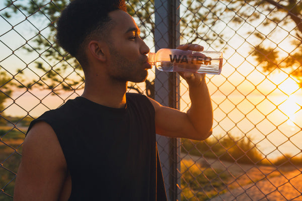 man drinking water for his beard health