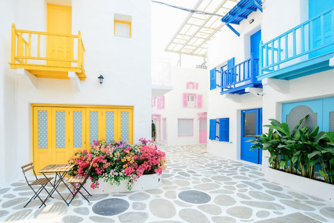 a white building with flowers