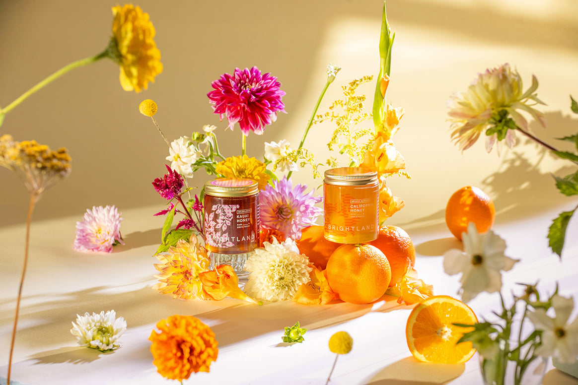 brightland honey duo with floral arrangement