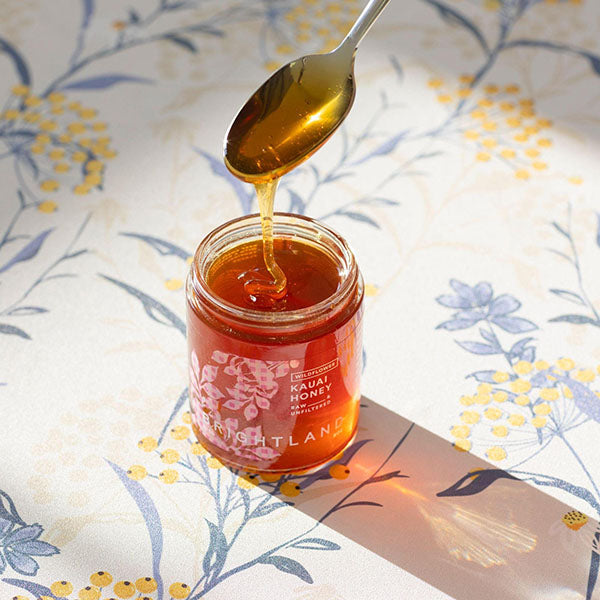 drizzling honey from spoon