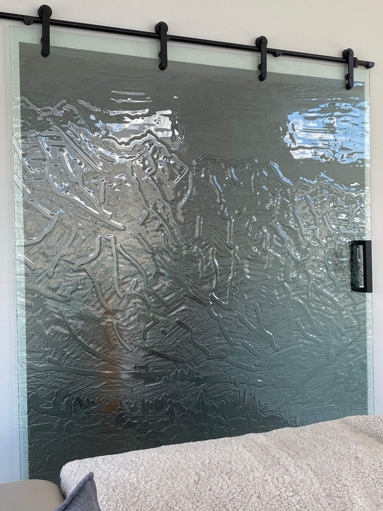 Sliding fluted patterned slumped glass barn slider door