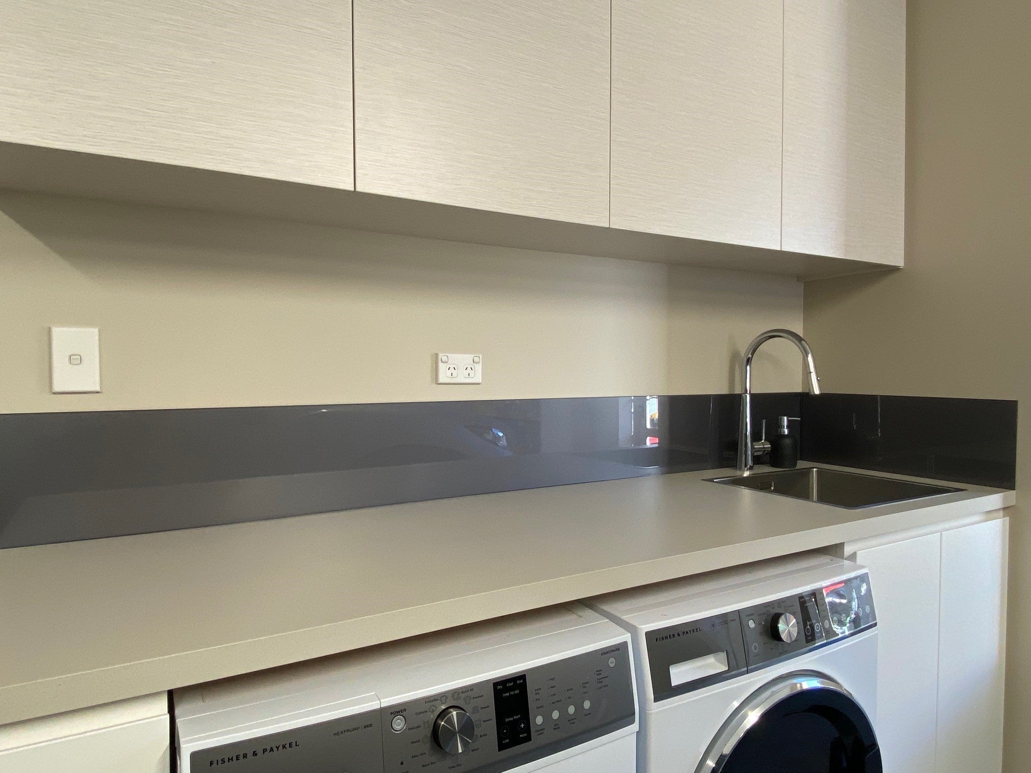 Flat coated glass in resene basalt - laundry splashback 