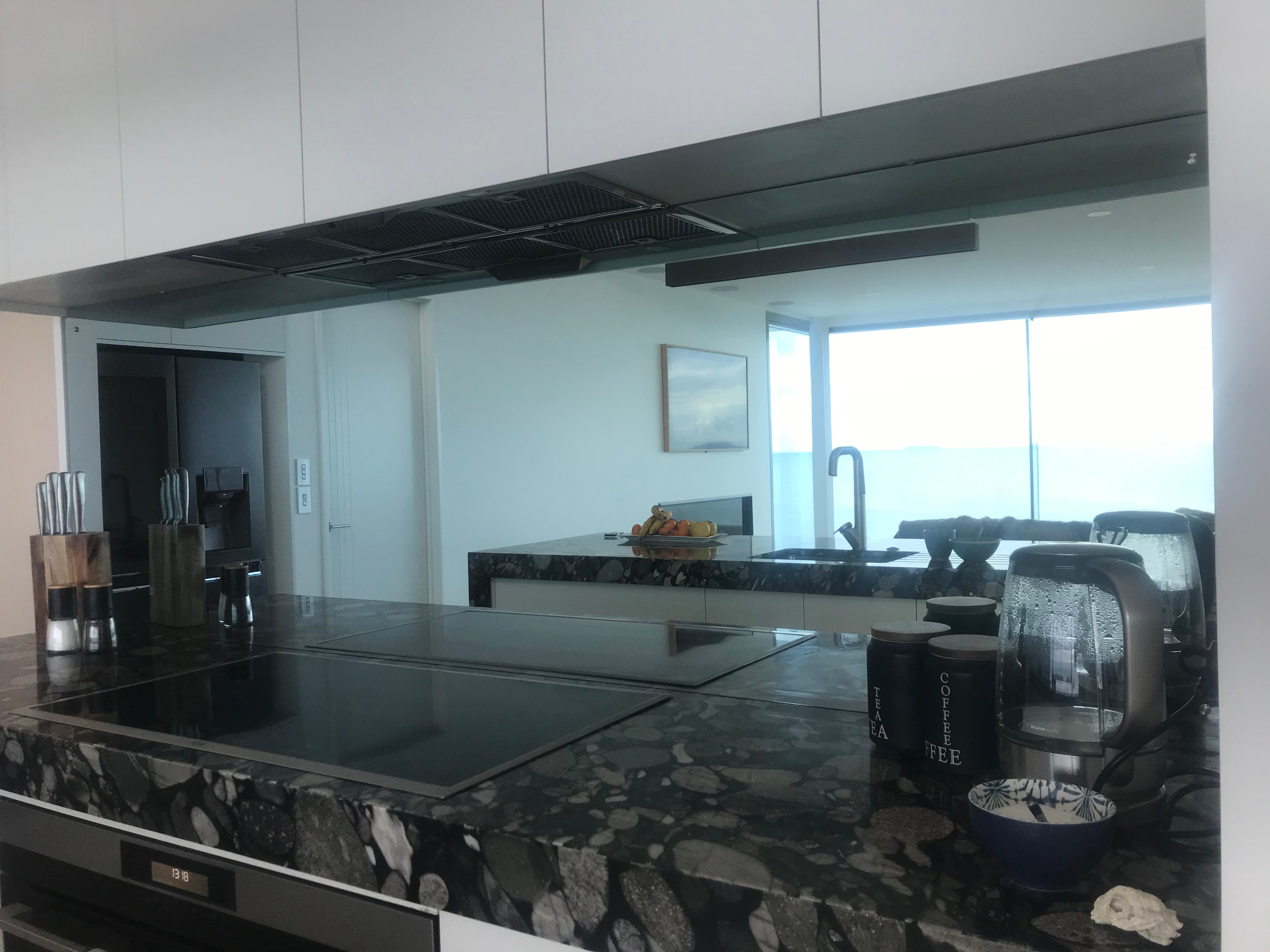 mirror mirrored glass grey tint splashback kitchen