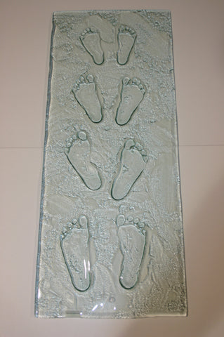 baby child glass foot prints in slumped glass like momentoes - cast in glass