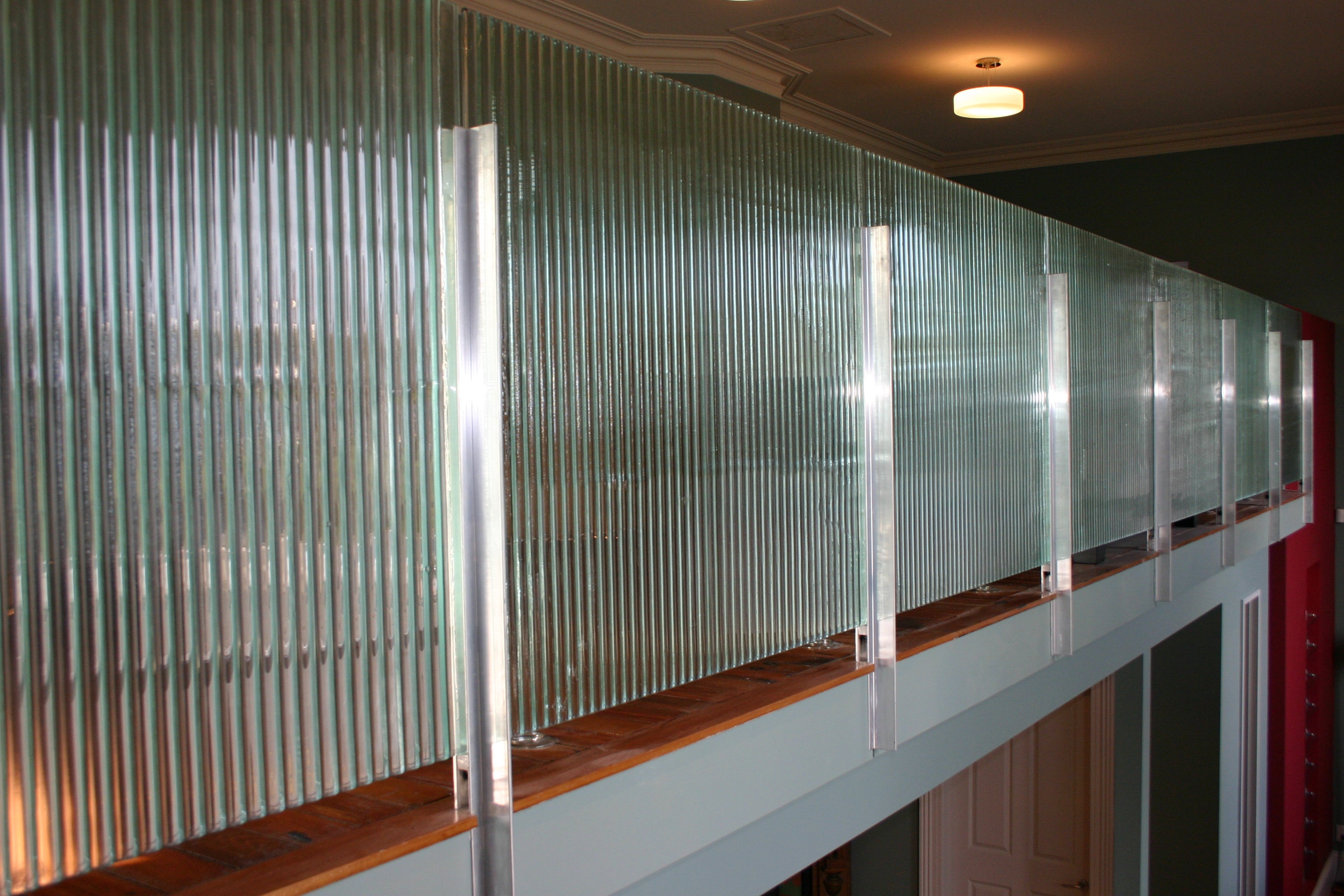 broad reeded fluted patterned slumped textured handmade glass in corrugate balustrading