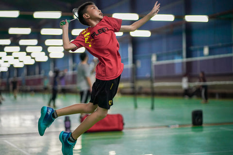 Badminton Player Smashing