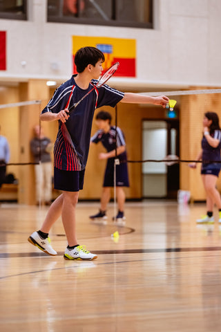 Badminton Player Serving