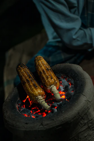 Fresh corn can be put directly on the charcoal for some perfect charring.