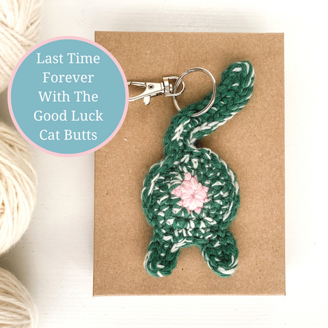 green good luck charm cat butt keychain with the text Last Time Forever With The Good Luck Cat Butts
