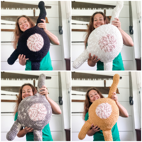 collage of a smiling woman holding each crocheted cat butt in each color (black, white, orange, and gray tabby) standing in front of a wall that has antique saws hanging from it