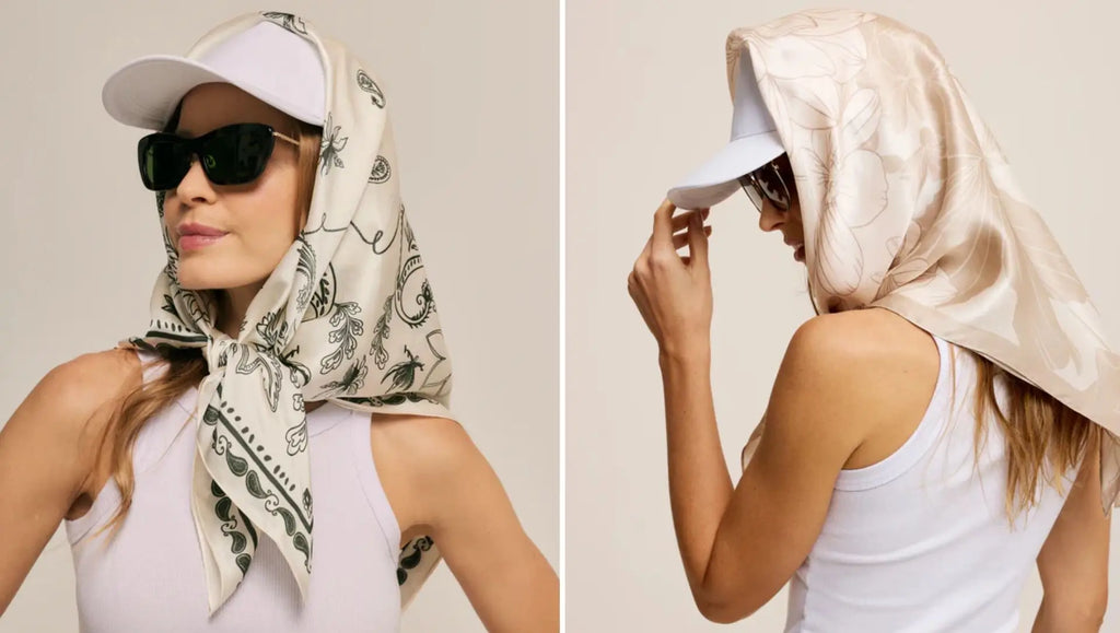 Two styles of scarves worn with a cap: a white scarf with a black paisley print and a satin beige scarf with a floral pattern, both complementing a sophisticated look.