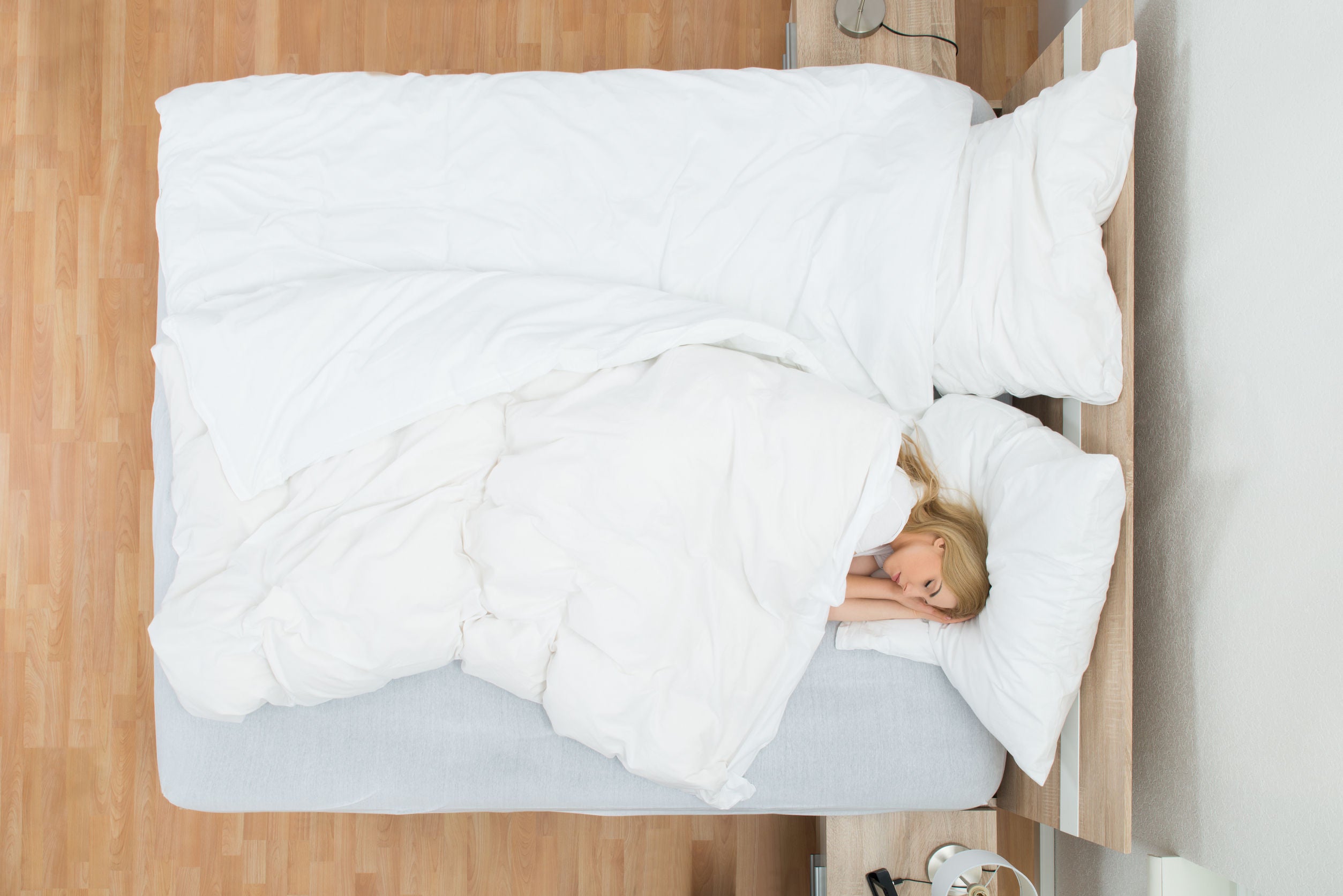 lady lying on a hybrid mattress in salt lake city