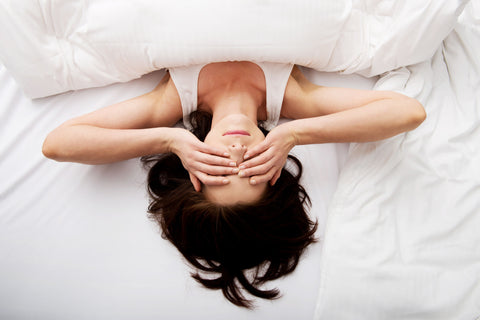woman sleeping on a mattress