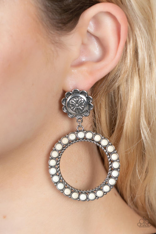 Playfully Prairie White Earring - Paparazzi Accessories  Featuring studded and twisted rope-like silver accents, a white stone dotted hoop swings from the bottom of a rustic silver flower for a whimsically floral fashion. Earring attaches to a standard post fitting.  Sold as one pair of post earrings.