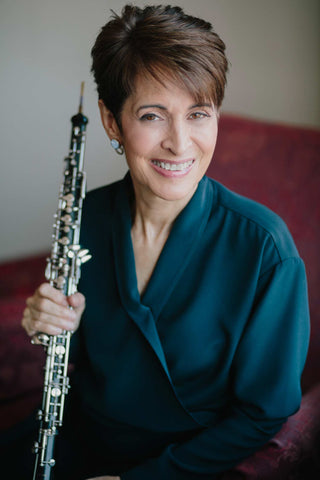 Oboe virtuoso and master oboe teacher Elaine Douvas holding her oboe