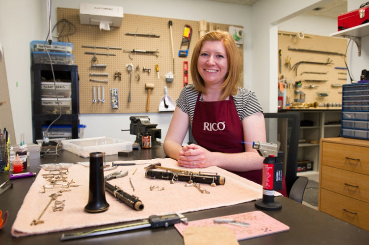 Nicole Bezaire at her band instrument repair work bench