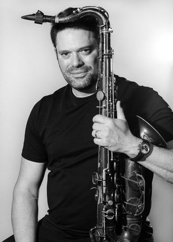 Ora Paul Haar holding a tenor saxophone