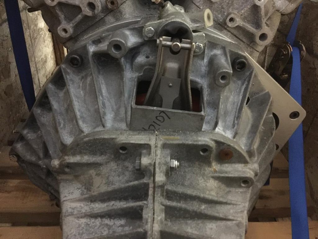 Close-up of a Ferrari engine mounted to a Renault transmission, highlighting the connection