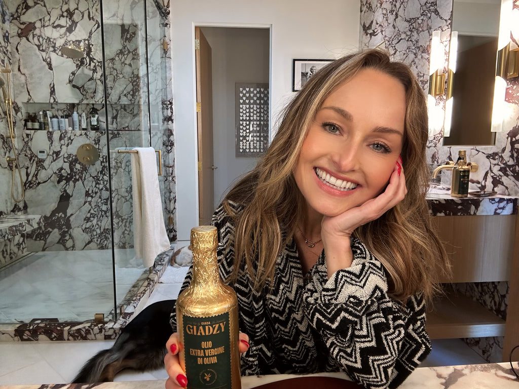 Giada with olive oil in her bathroom